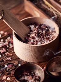 Ayurveda bath salts in wooden bowl