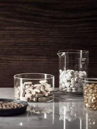 Nutritional Therapist Adv pills in glass jars