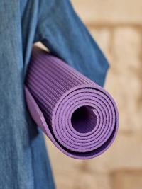 Yoga course mat under arm