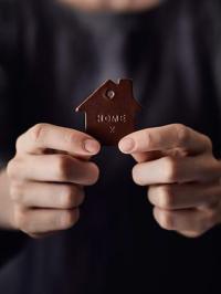 Homeopathy Home sign in hands